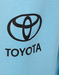 Close-up of light blue fabric featuring the Toyota logo