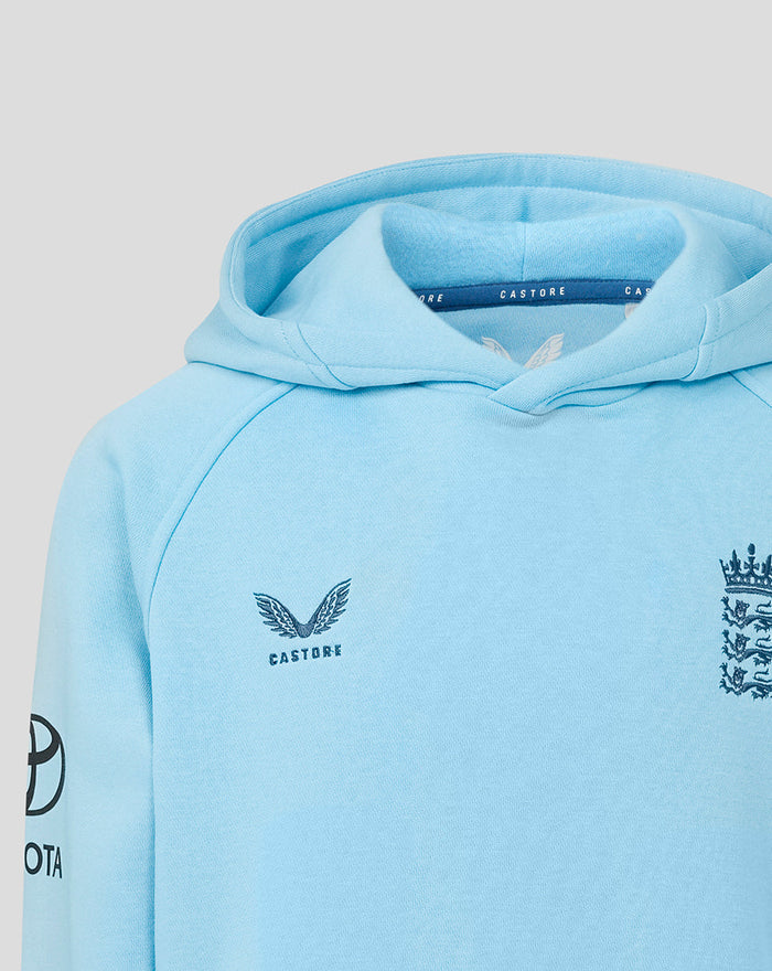 Light blue junior Travel Adapt fleece hoodie with three lions crest on the chest and Castore wing logo