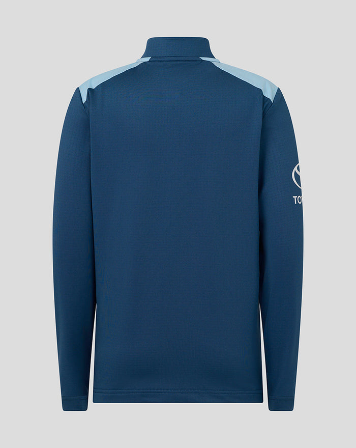 Back view of junior blue training midlayer with pale blue shoulder panels.