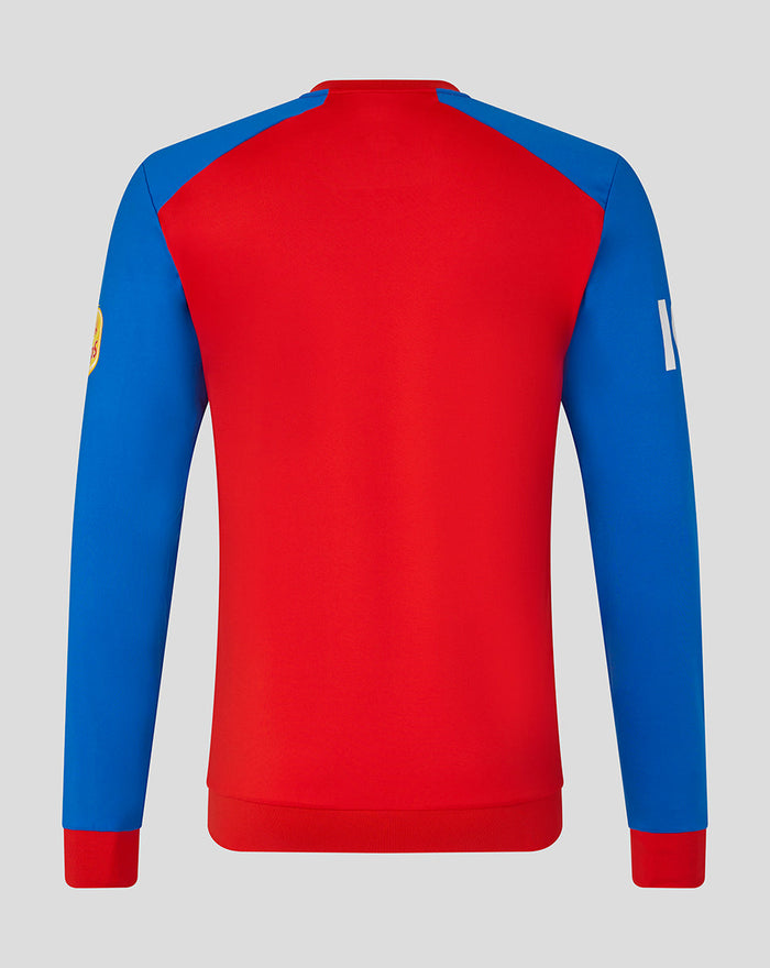 Back view of a red T20 sweater with blue sleeves and contrasting shoulder panels