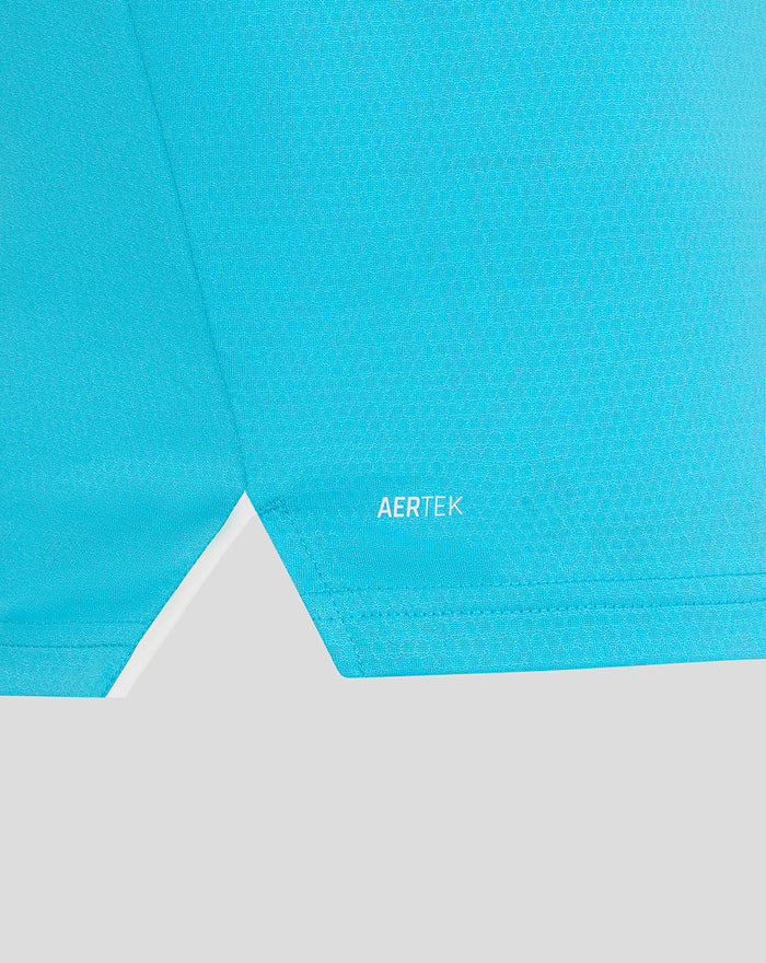 Close-up of the blue ODI Pro long sleeve shirt hem showing AERTEK branding.