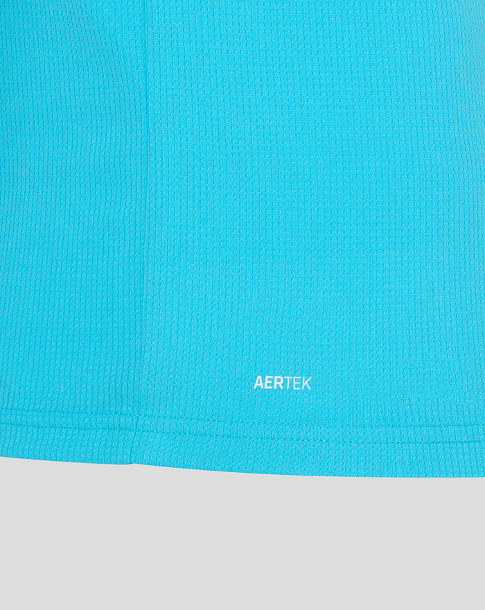 Close-up of bright blue ODI short sleeve shirt fabric with AERTEK branding at the hem