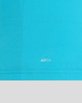 Close up of blue ODI shirt fabric with AERTEK branding at the hem