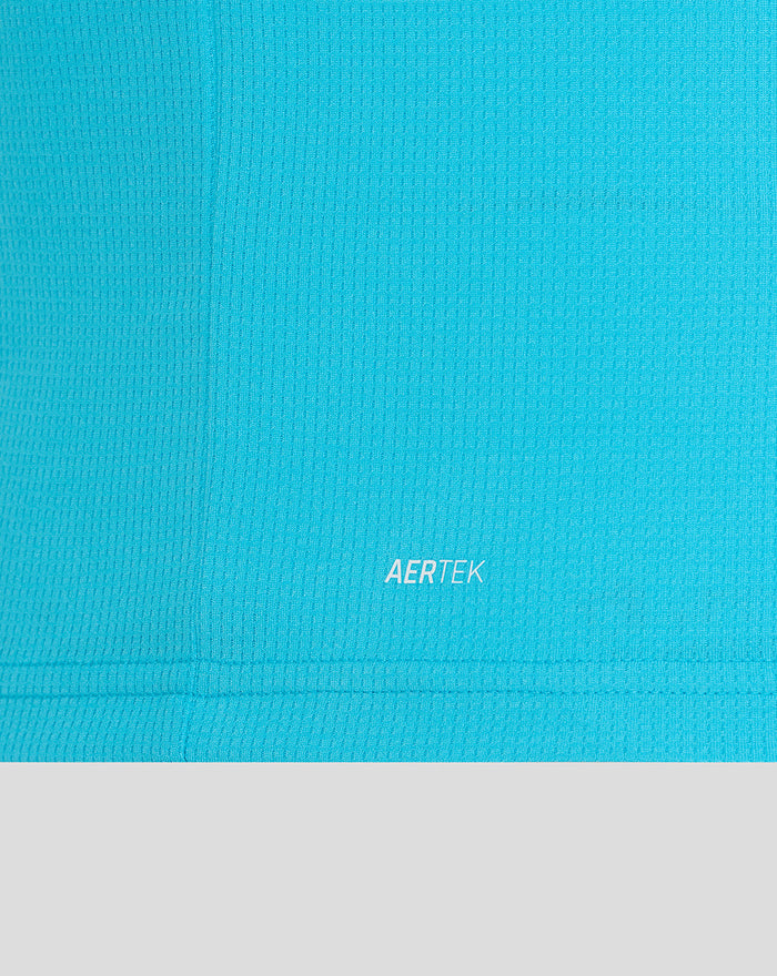 Close up of blue ODI shirt fabric with AERTEK branding at the hem