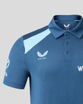 Close up of blue training polo with light blue shoulder panel Castore logo and Three Lions crest