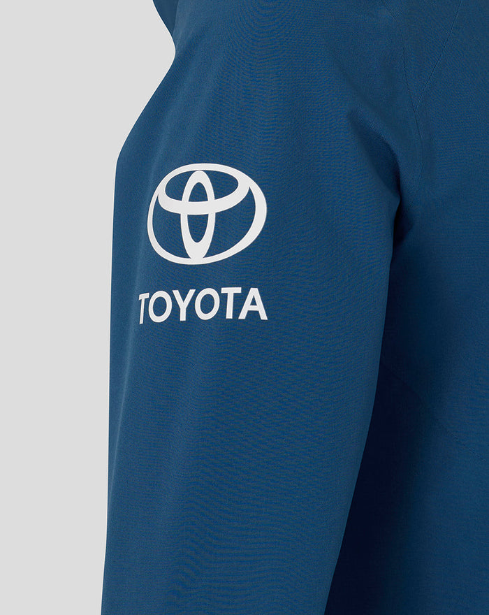 Blue training jacket sleeve with white Toyota logo