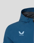 Blue training jacket chest with white Castore logo and wings