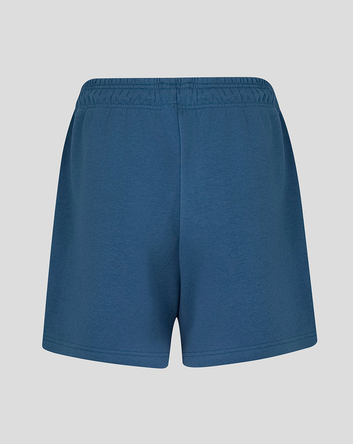 Back view of women's ensign blue travel fleece shorts with an elastic waistband