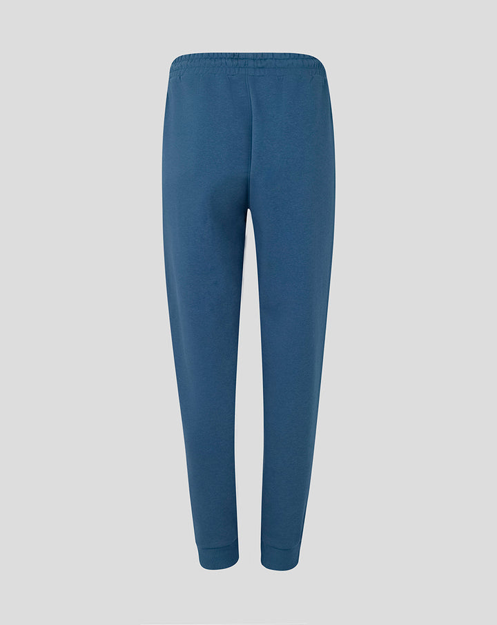 Back view of women's Ensign Blue Travel Adapt Fleece Joggers with elastic cuffs.