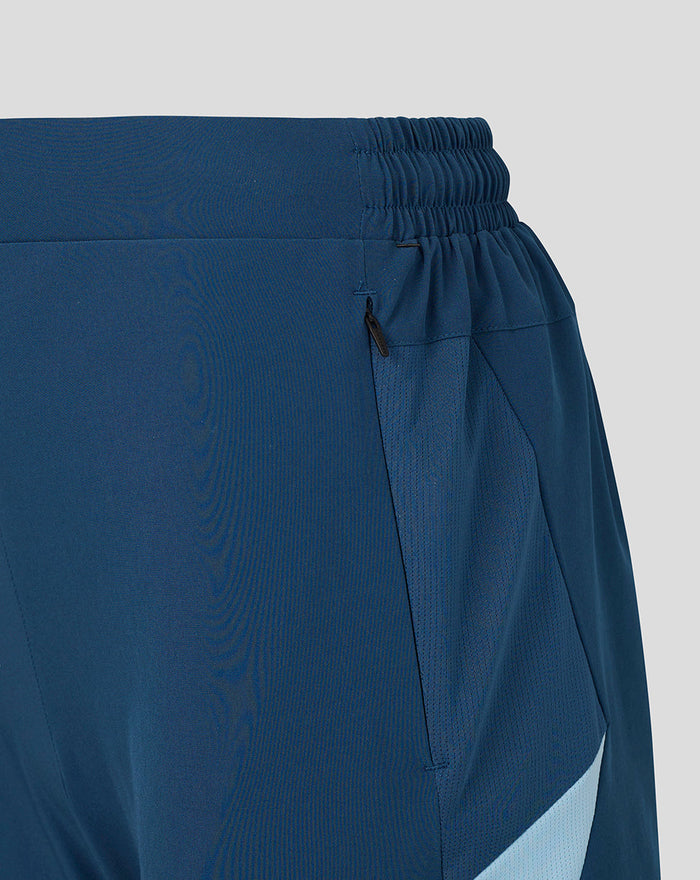 Blue women's training shorts waist area with elastic band and side zip pocket