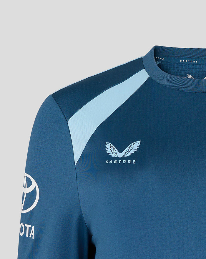 Close up of blue training sweatshirt showing Three Lions crest and Castore branding on the chest