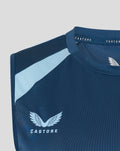 Blue sleeveless training top with light blue shoulder panel and England Cricket crest.