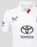 Front view of white cricket jersey with Castore logo on chest and Toyota sponsor and red shoulder piping.