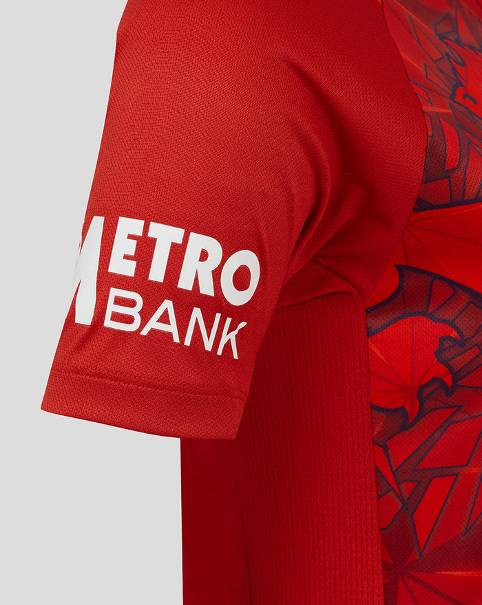 Red ECB Women's 25/26 T20 replica shirt sleeve with white Metro Bank logo