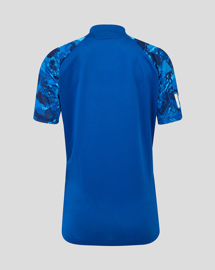 Back view of blue ECB women's 25/26 Odi replica short sleeve shirt with camo patterned sleeves.