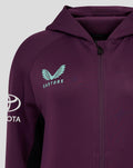 Close up of ECB Women's 25/26 Training Full Zip Hoody in deep purple showing turquoise Castore chest logo and sleeve emblem