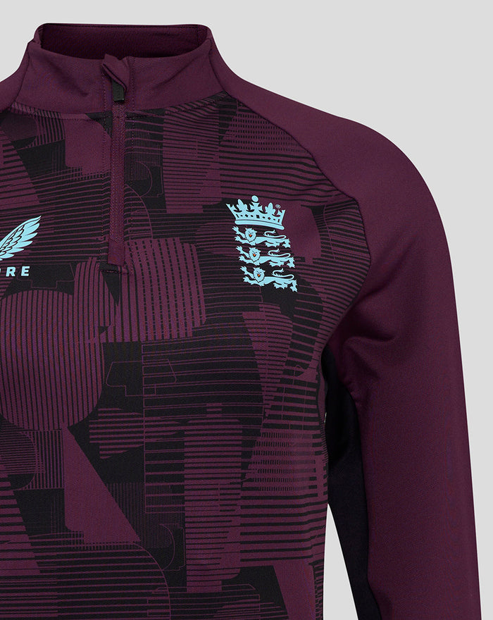 Front view of ECB 1/4 zip training top with light blue Castore wing logo and England crest on purple pattern.