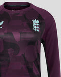 Front upper body close up featuring England crest on ECB Women's 25/26 Training Long Sleeve Tee with purple graphic motif