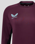 Close-up of burgundy ECB training sweatshirt chest with light blue England crest and ribbed crew neckline