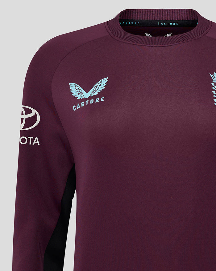 Dark burgundy ECB Women's 25/26 training sweatshirt with light blue Castore wing logo on the chest and Toyota sleeve branding.