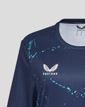 Close up of navy training jersey showing Castore logo and teal splatter design.