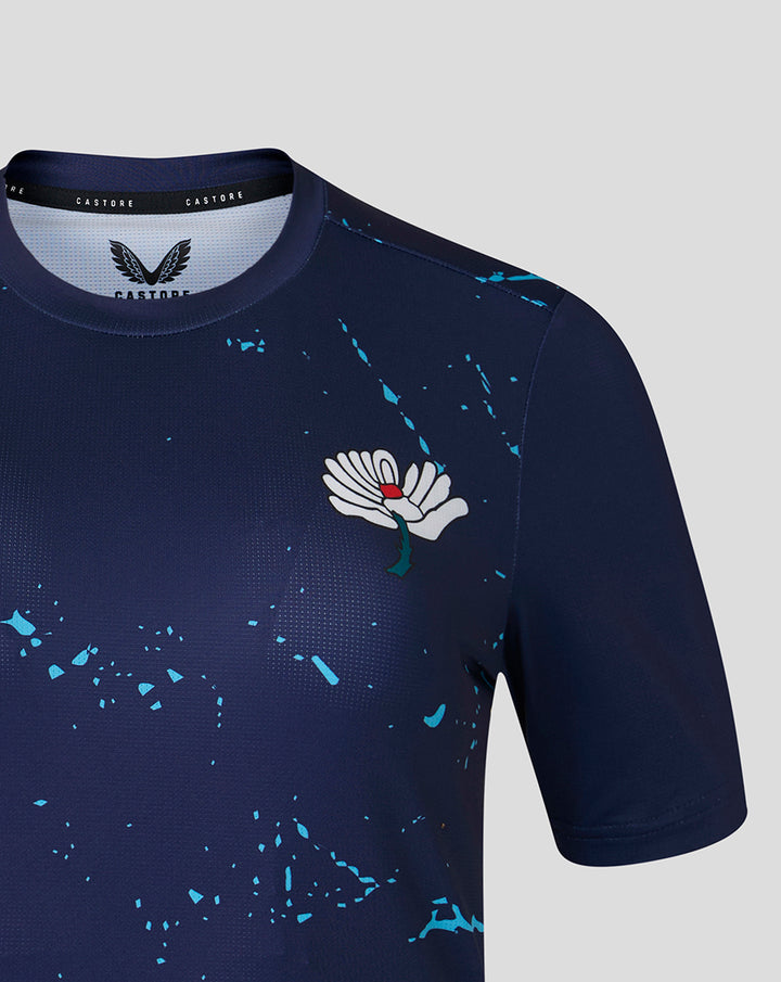 Front view of navy performance tee showing White Rose crest on the chest with blue splatter accents.