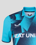Close up of front chest on turquoise and navy geometric jersey with Castore branding at the collar and SEAT UNIQUE across chest.