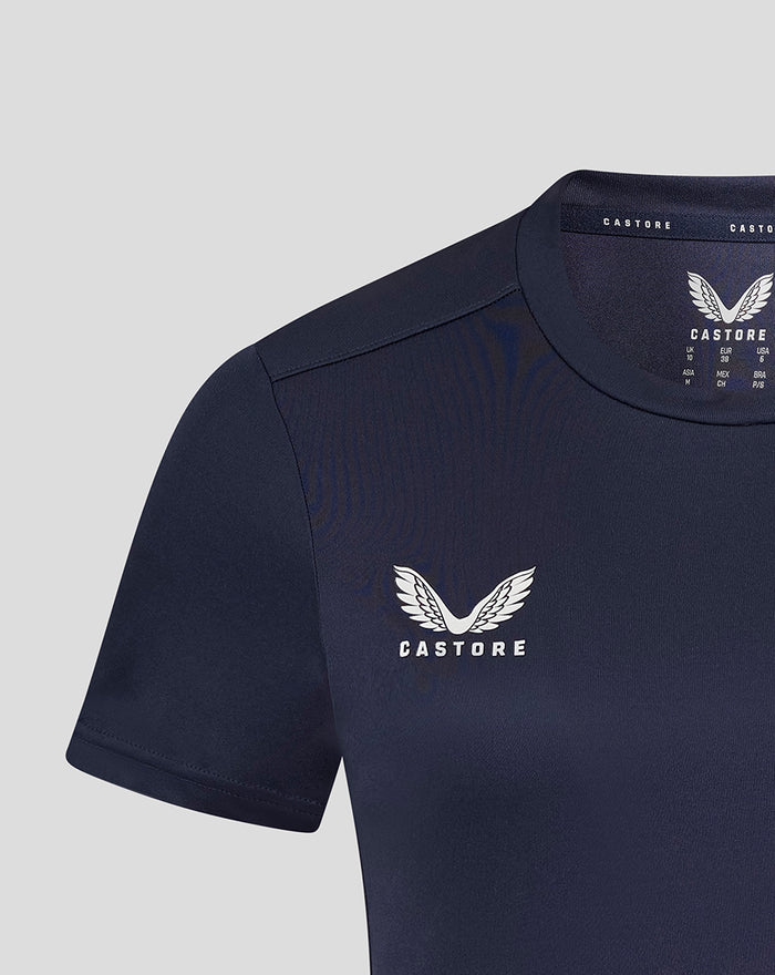 Close up of navy training tee chest area with white Castore logo and wing emblem