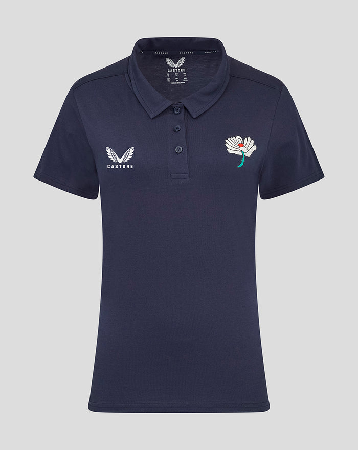 Navy Yorkshire polo shirt front view with white wing Castore logo on the left chest and a white flower emblem on the right chest.