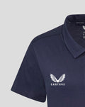 Close-up of navy polo chest featuring the Castore wing logo.