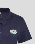 Navy womens polo in a cotton blend with a white flower crest on the left chest and teal stem