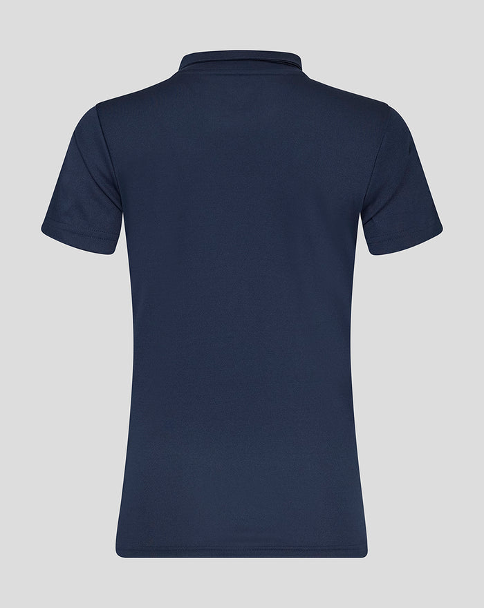 Back view of a navy womens short sleeve training polo with a clean plain silhouette