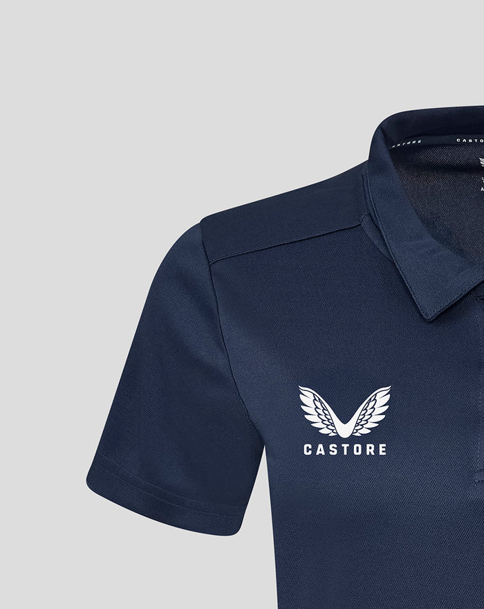 Close up of navy Yorkshire training polo short sleeve showing textured polyester fabric and white wing crest on chest