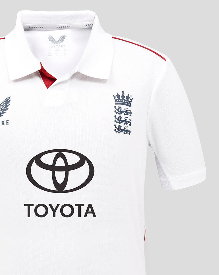 Front view of white ECB Junior Test Replica shirt with Castore wing logo on left chest, England crest on right chest, and Toyota sponsor in the center.