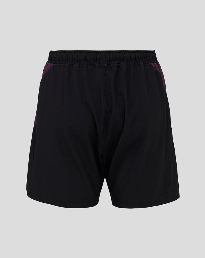 Back view of ECB Junior training shorts in black with purple side panels and an elastic waistband