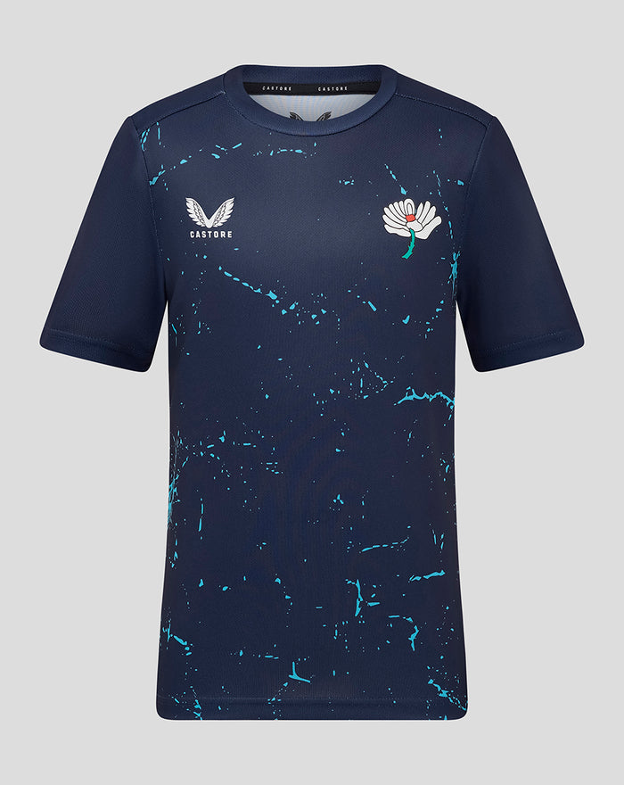Front view of juniors Yorkshire Graphic Short Sleeve Training Jersey in navy with turquoise splash pattern and Castore logo.