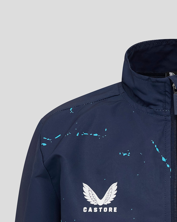 Close-up of navy jacket shoulder with turquoise splatters and Castore logo on the chest