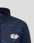 Navy track jacket chest featuring the white Castore wing logo and turquoise paint splatter details