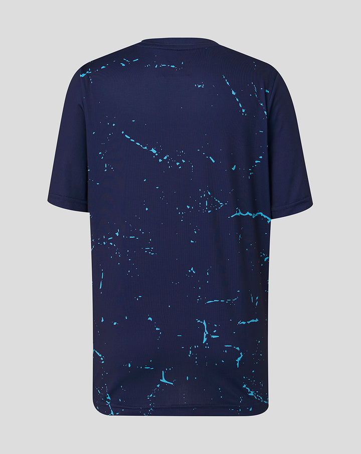 Back view of navy Peacoat Junior 26/27 short sleeve performance T-shirt with turquoise splatter pattern.