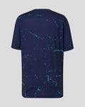 Back view of navy Peacoat Junior 26/27 short sleeve performance T-shirt with turquoise splatter pattern.