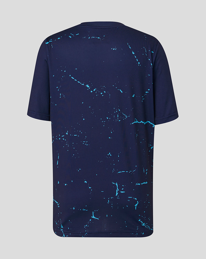 Back view of navy Peacoat Junior 26/27 short sleeve performance T-shirt with turquoise splatter pattern.