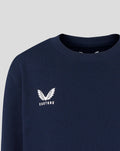 Close up of white Castore logo on the navy crewneck sweatshirt chest