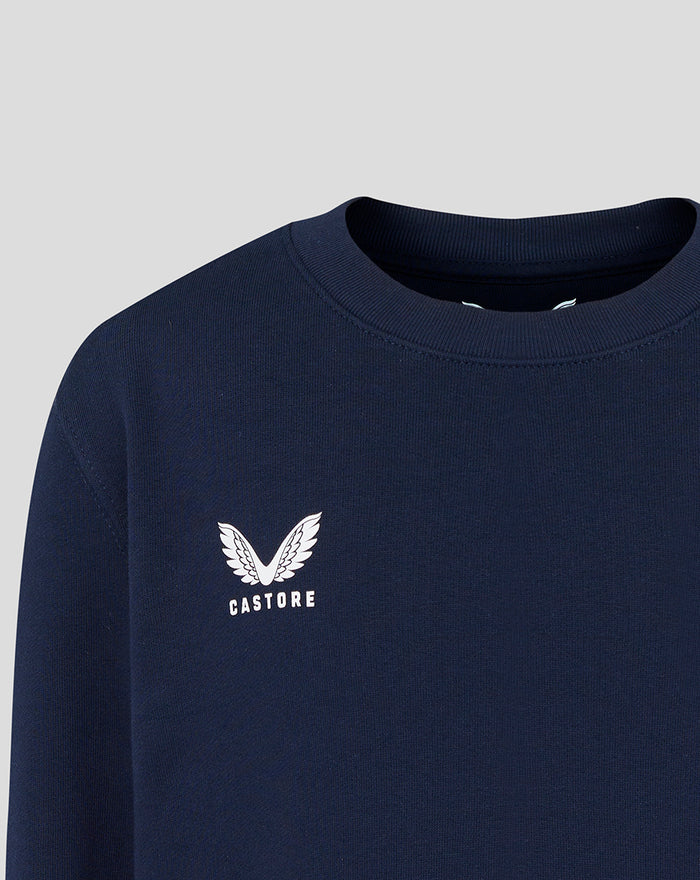 Close up of white Castore logo on the navy crewneck sweatshirt chest