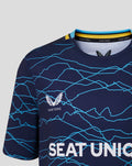 Front close up of the navy junior jersey showing Castore branding on the chest and the blue crackle pattern.