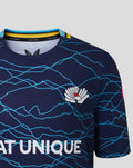 Close-up of junior 26/27 T20 short sleeve jersey in peacoat navy with a blue crackle pattern, White Rose crest on the chest and Seat Unique across the front