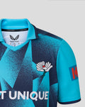 Front close-up of the blue geometric jersey showing the SEAT UNIQUE wordmark and winged Castore emblem.