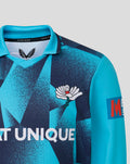 Front view of Junior 26/27 OD Long Sleeve Jersey in teal with geometric print and winged crest on chest plus Castore branding at the collar