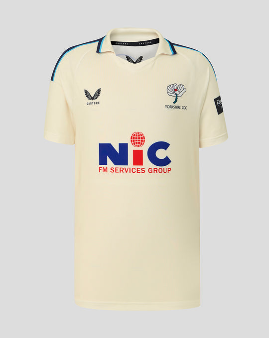 Cream County Champs short sleeve cricket jersey with blue piping on shoulders and collar, crest on chest and NIC sponsor logo across the front