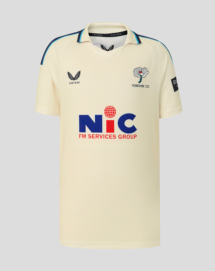 Cream County Champs short sleeve cricket jersey with blue piping on shoulders and collar, crest on chest and NIC sponsor logo across the front