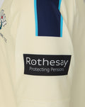 Junior 26/27 County Champs Short Sleeve Jersey in cream with Rothesay sponsor patch on the sleeve